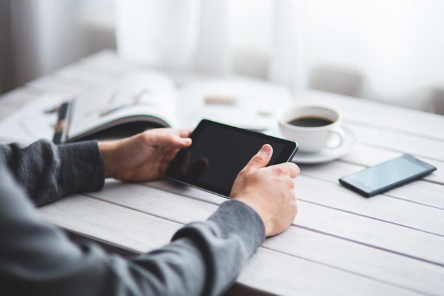 Professional reviewing information on a tablet