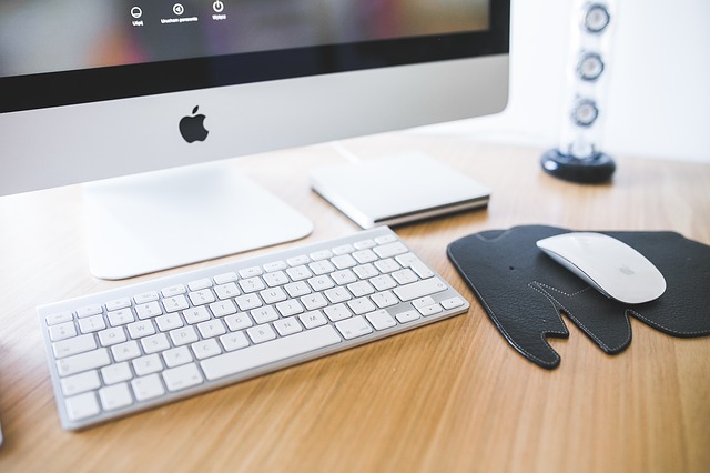 Computer keyboard and monitor in a digital workspace